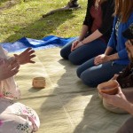 Explaining tea ceremony to guests.